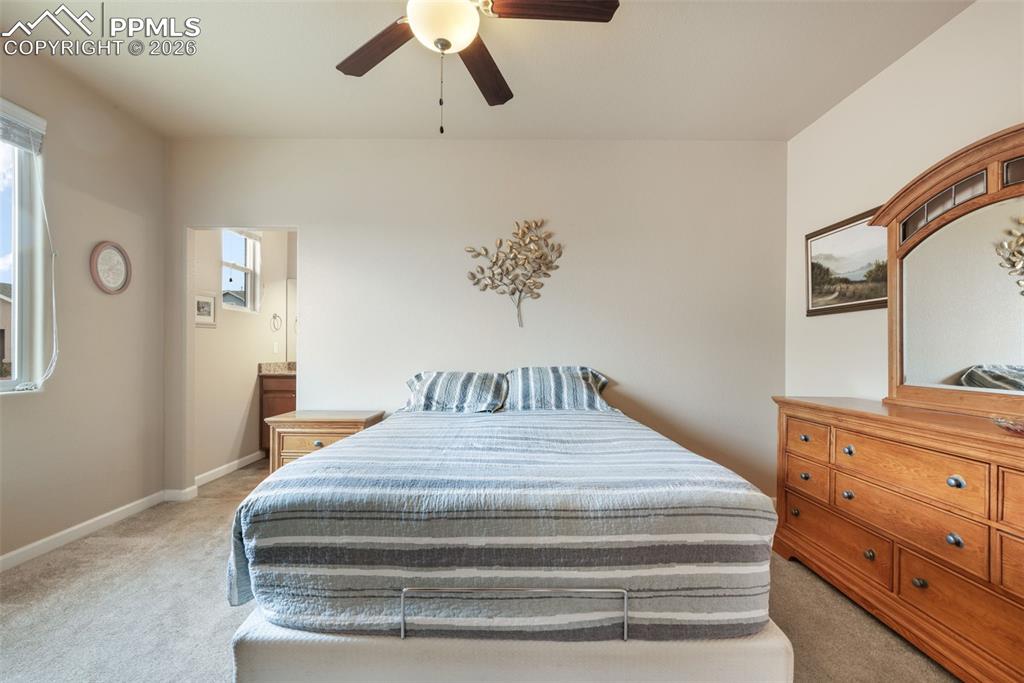 Image 21 of 50: Kitchen featuring wood-finish flooring, stainless steel appliances, granite