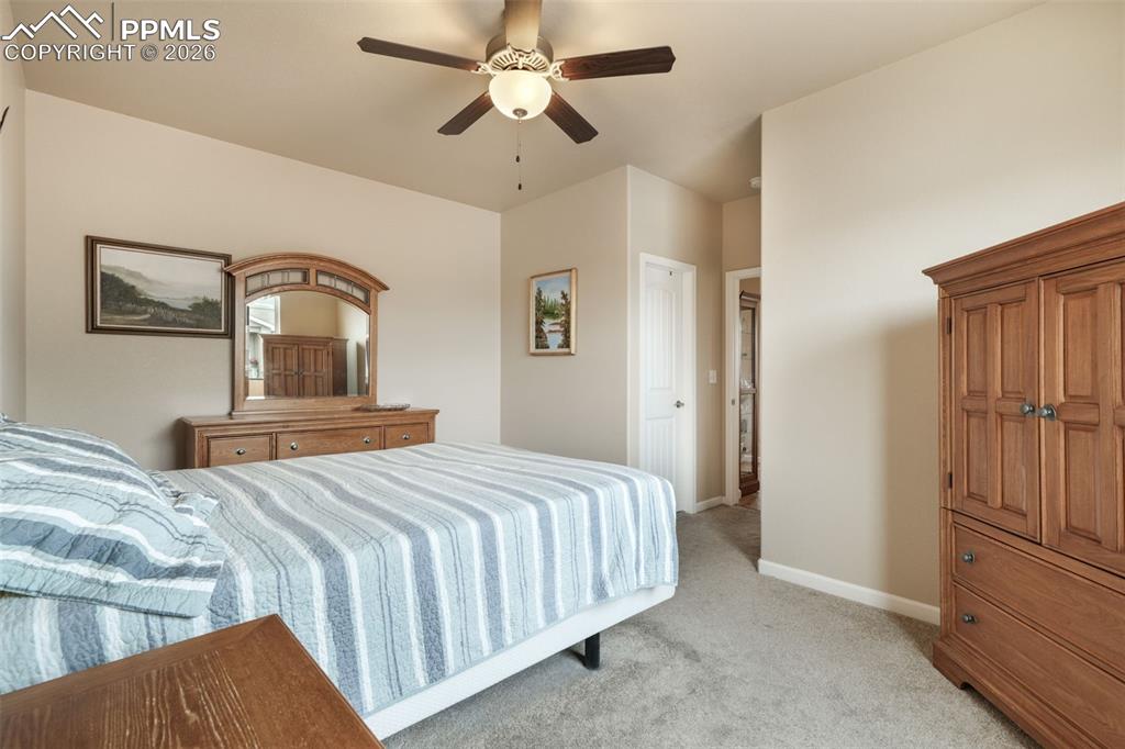 Image 22 of 50: Dedicated laundry area featuring a wire storage shelf