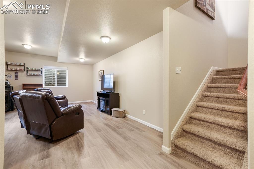 Image 27 of 50: Bathroom featuring a dual vanity with light-toned countertop, integrated si