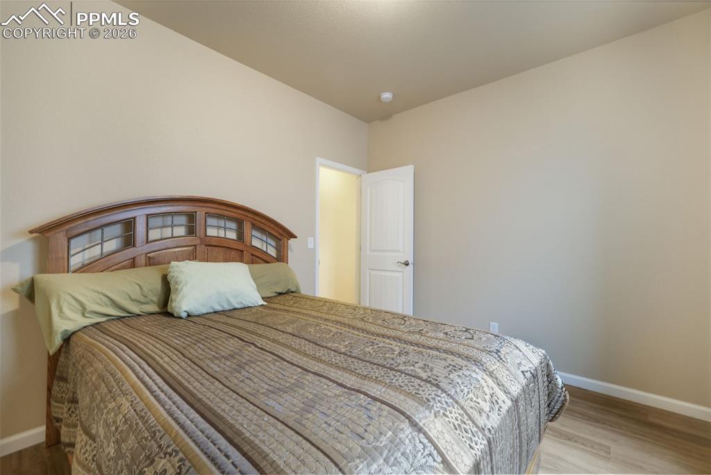 Image 32 of 50: Recreational room with light wood-finish flooring, recessed lighting, and a