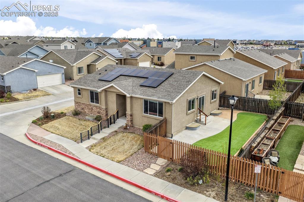 Image 39 of 50: Room featuring wood-finish flooring, a white interior door with an arched p