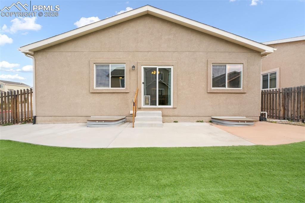 Image 41 of 50: Residential neighborhood with varied architectural styles, asphalt streets,