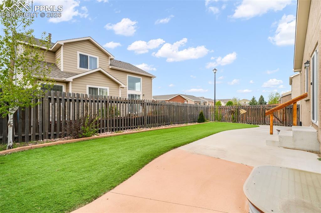 Image 42 of 50: Stucco exterior home featuring a stone accent façade and solar panels