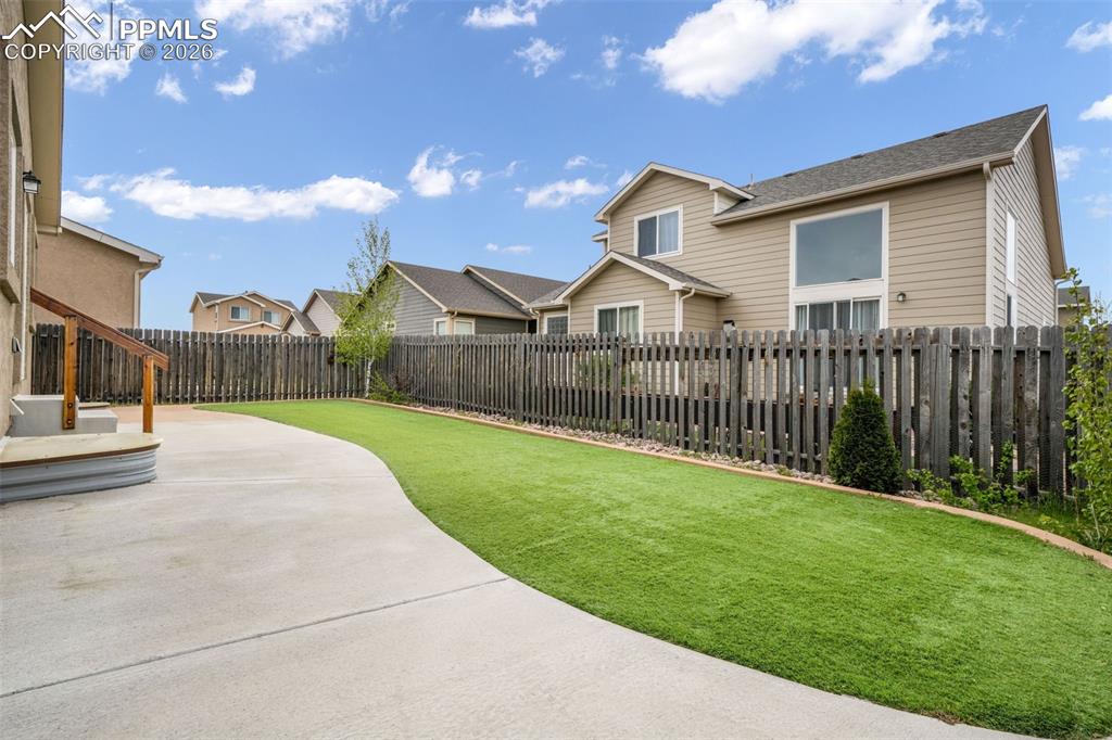 Image 43 of 50: Single-story residence featuring rooftop solar panels