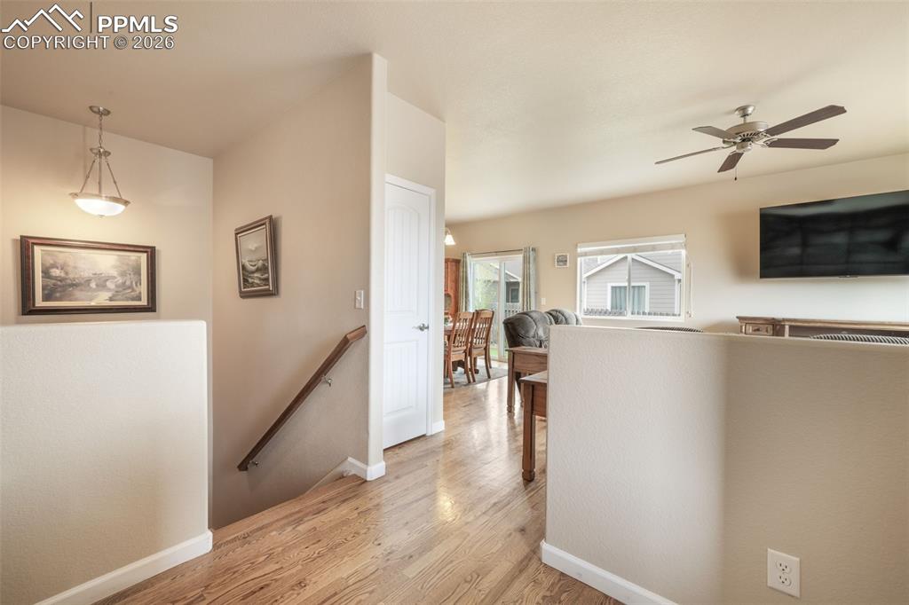Image 6 of 50: Stucco exterior featuring a stone accent façade and an attached garage