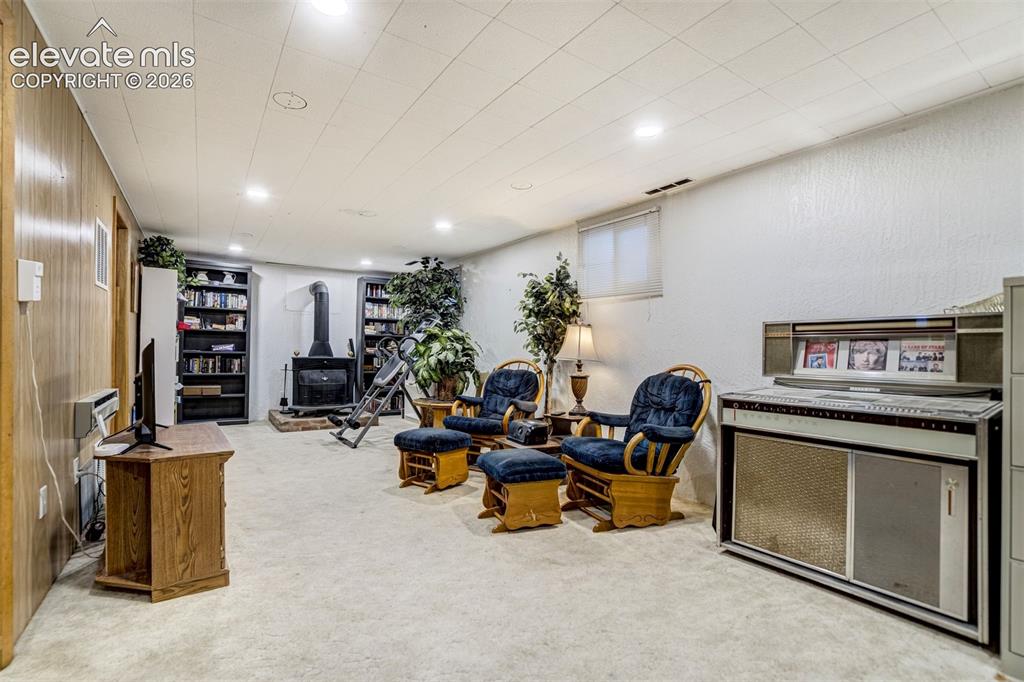 Image 28 of 45: Huge basement family room.