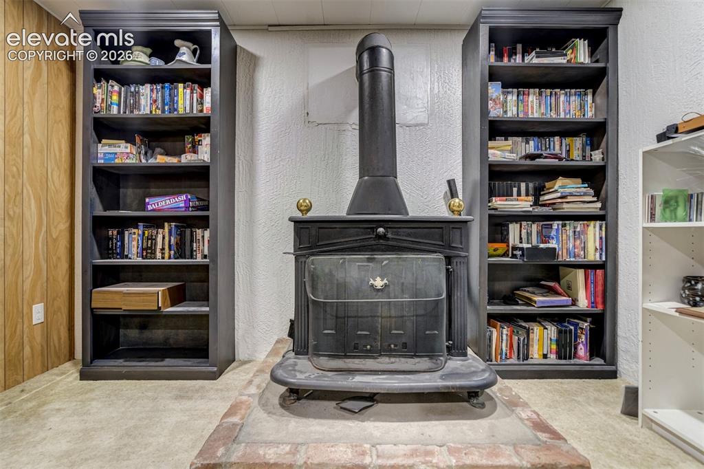 Image 34 of 45: Converted electric stove in basement.