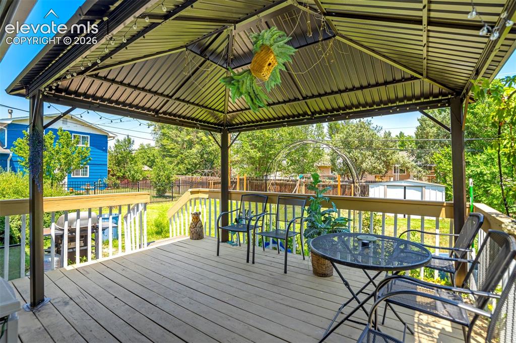 Image 36 of 45: Fixed gazebo will stay for wonderful outdoor living space.