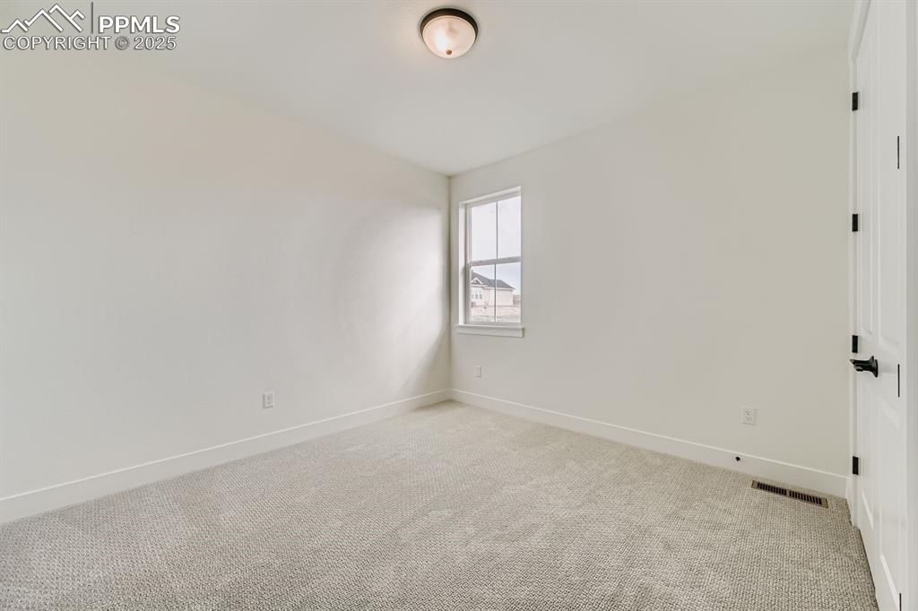 Image 19 of 27: Unfurnished room featuring baseboards and light colored carpet