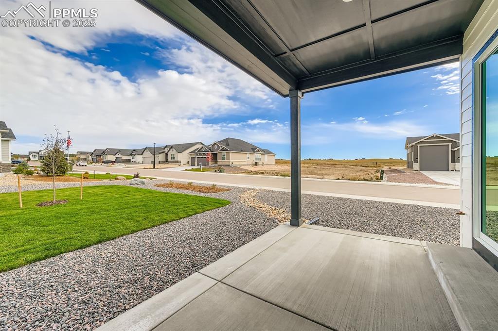 Image 26 of 27: View of patio featuring a residential view