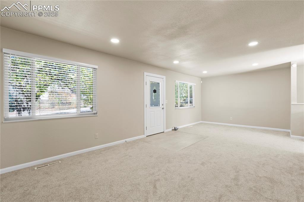 Image 13 of 35: Carpeted foyer entrance featuring recessed lighting and a textured ceiling