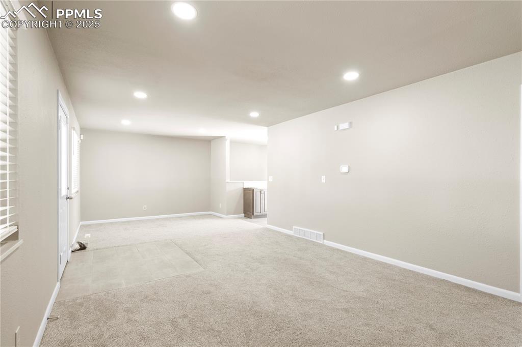 Image 14 of 35: Carpeted empty room with recessed lighting