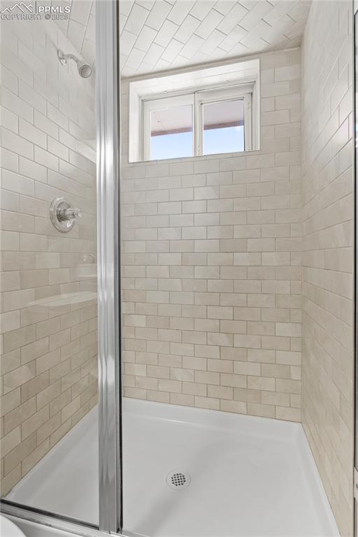 Image 23 of 35: Full bathroom featuring a stall shower