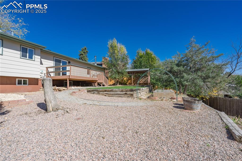 Image 31 of 35: View of yard with a deck