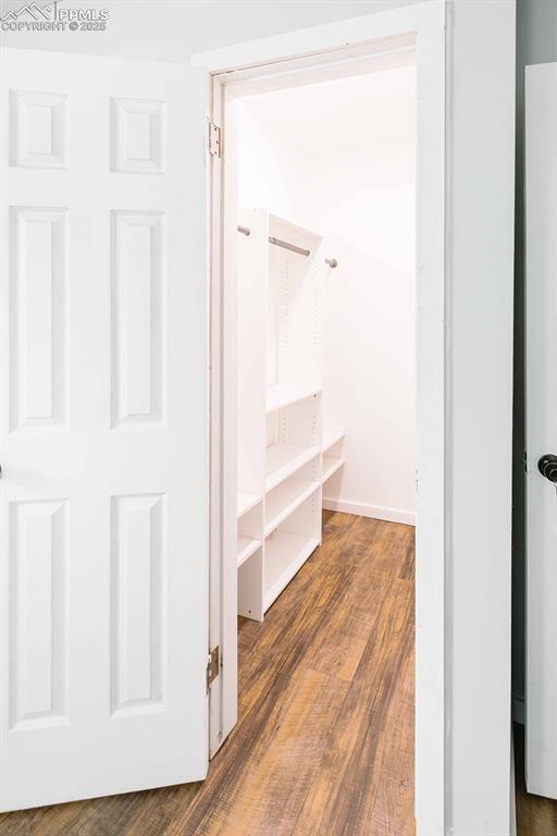 Image 18 of 43: Primary bedroom walk in closet.