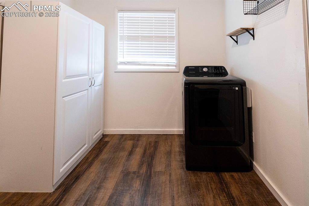 Image 31 of 43: Washer and dryer stay. Huge storage cabinet stays.