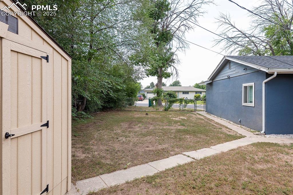 Image 40 of 43: View of the side yard at the east side of the property.