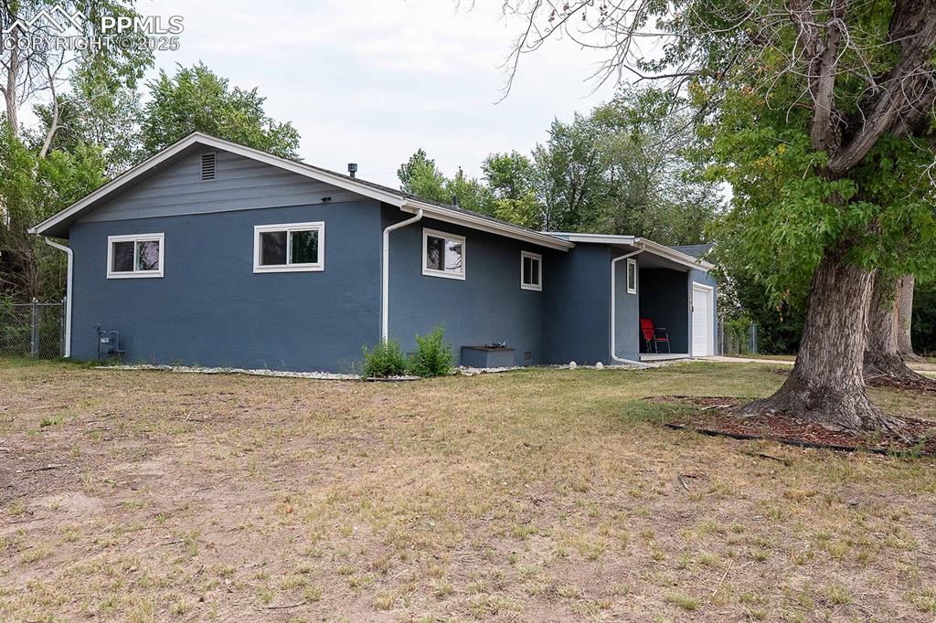 Image 5 of 43: Large corner lot with shade trees.