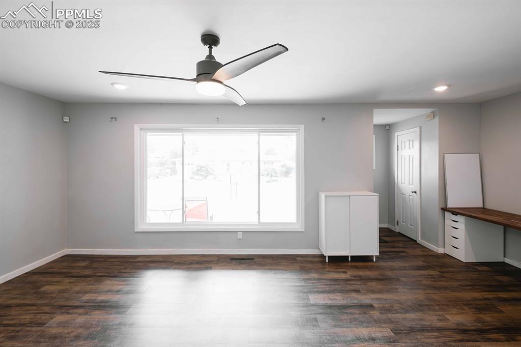 Image 8 of 43: Large picture window at front. Windows have been repaced in recent years