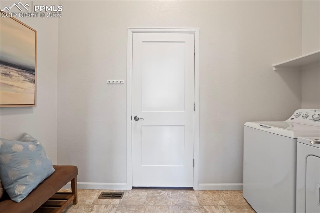Image 28 of 50: main level laundry and mudroom