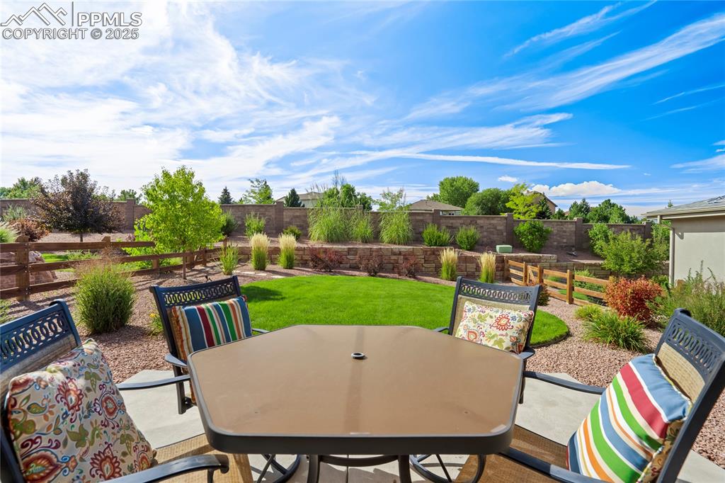 Image 42 of 50: Extended rear concrete patio for everyday outdoor living