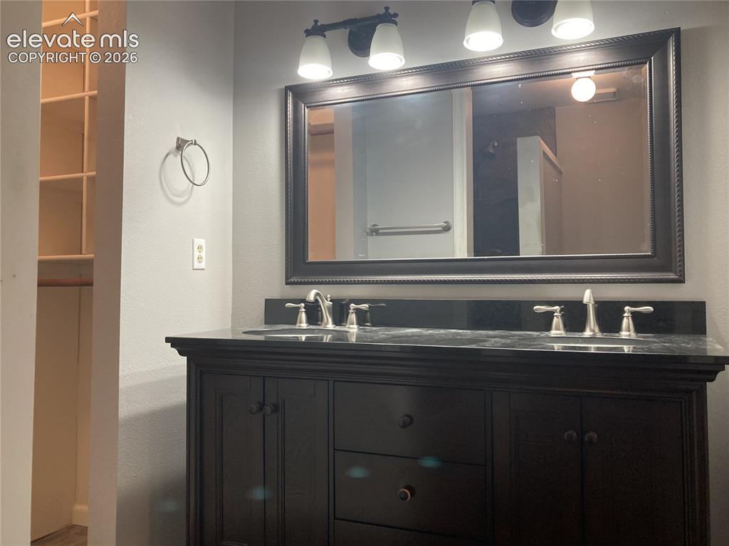 Image 10 of 15: Master bath vanity