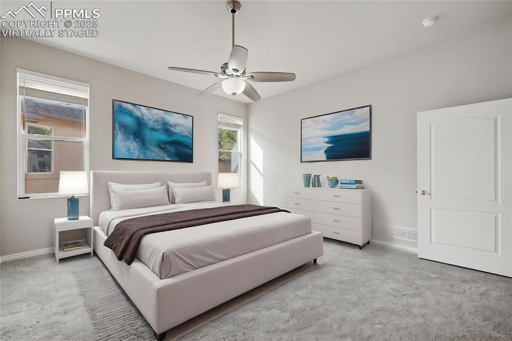 Image 8 of 29: Virtually Staged Master bedroom featuring a ceiling fan and baseboards