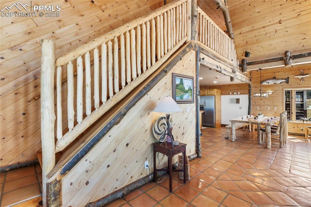 Image 13 of 48: custom-built railing to the upper loft/office