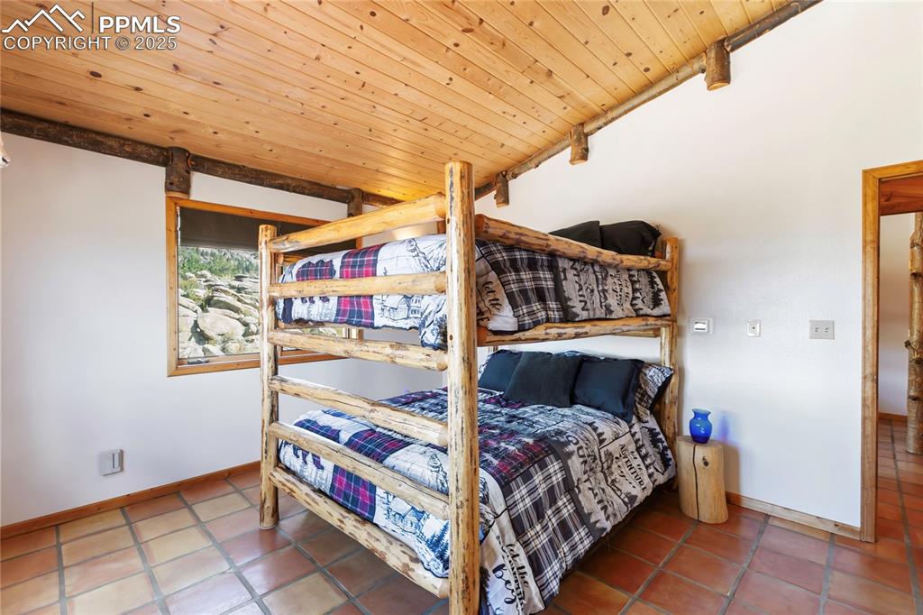 Image 23 of 48: 2nd bedroom - upper level - bunk beds will stay with the house