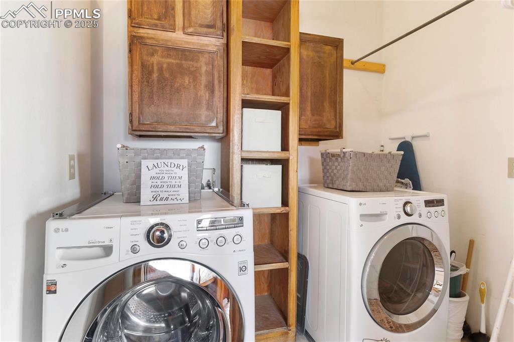 Image 26 of 48: 2nd floor laundry with storage