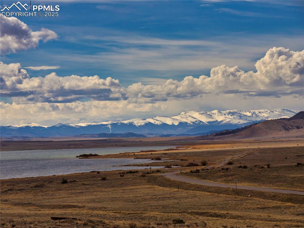 Image 34 of 48: Mountain view with a nearby body of water