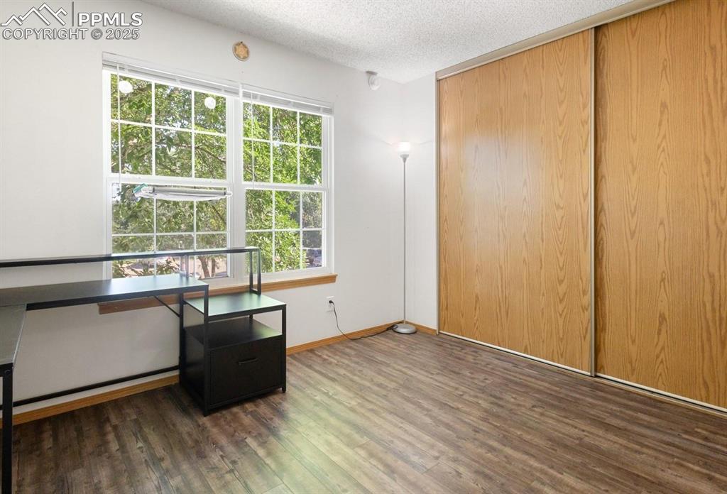 Image 13 of 27: Secondary bedroom with LVP flooring