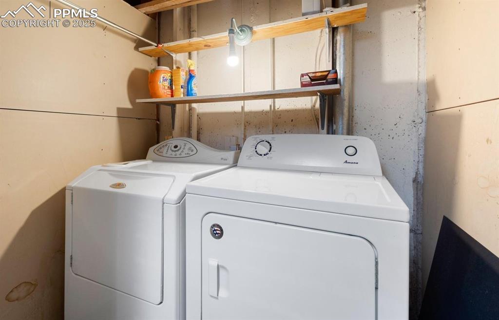 Image 18 of 27: Laundry room featuring washer and clothes dryer
