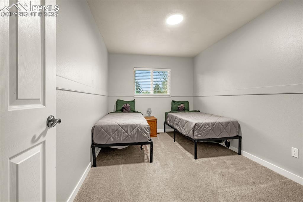 Image 13 of 22: Bedroom featuring carpet floors and baseboards
