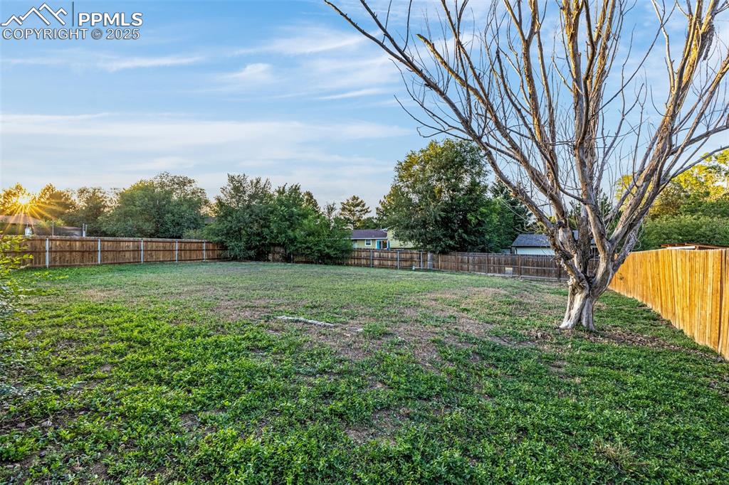 Image 22 of 22: View of fenced backyard