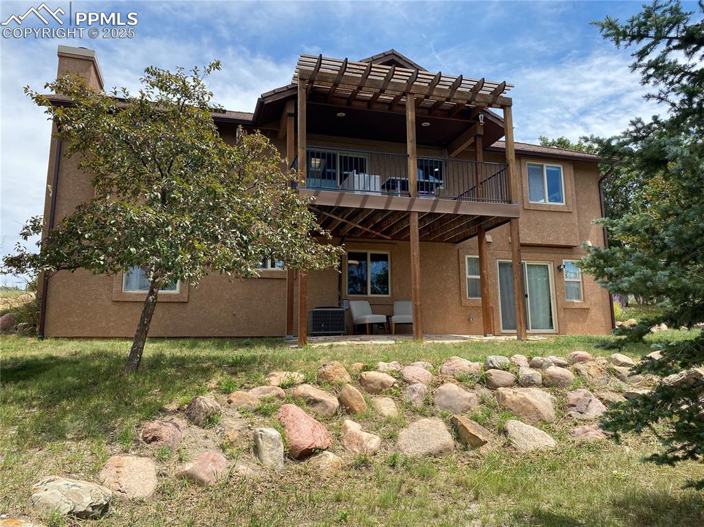 Image 15 of 48: The DUAL patio and deck are both covered and comfortable