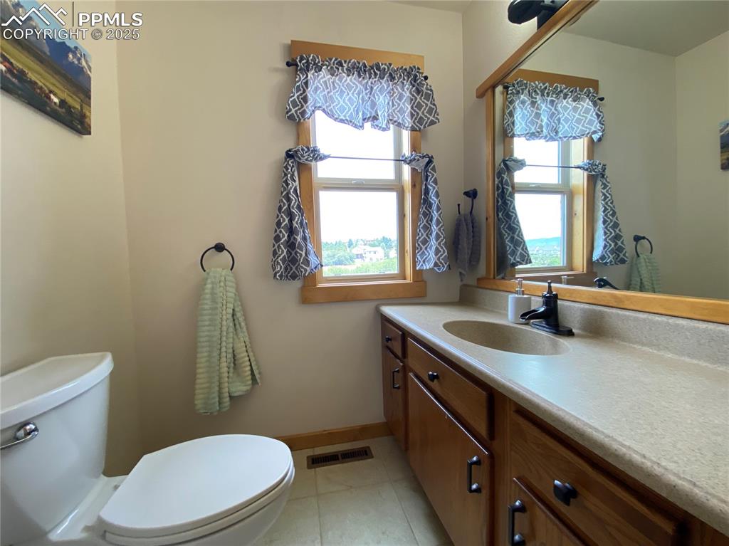 Image 32 of 48: The powder room provides easy access for guests