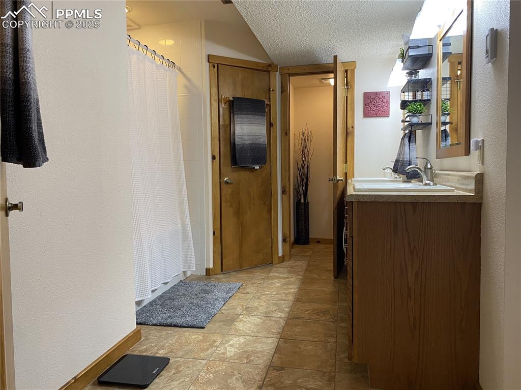 Image 40 of 48: DUAL walk-in closets & a heated ceramic tile floor add luxury