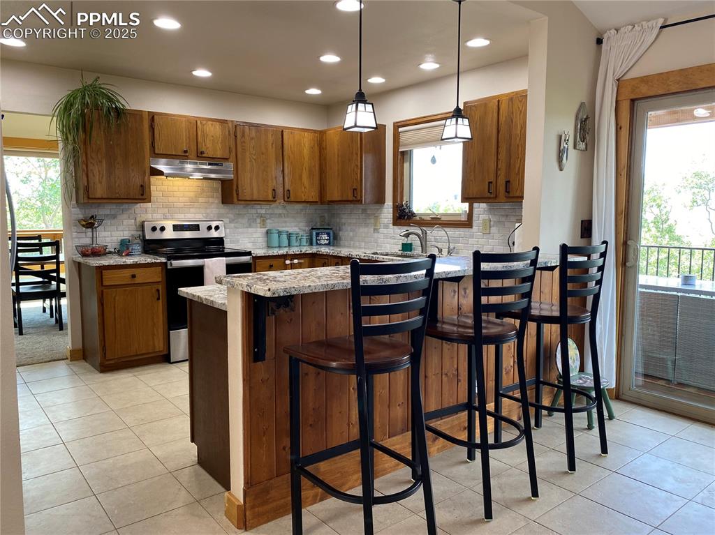 Image 6 of 48: Granite kitchen counters and custom cabinets