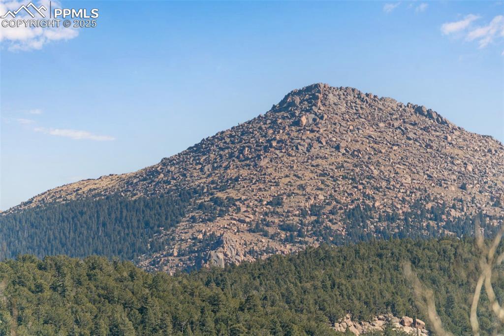 Image 33 of 34: Mountain view with a heavily wooded area