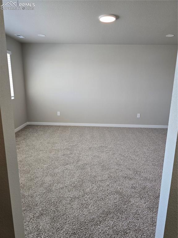 Image 14 of 15: Spare room with carpet flooring, a textured ceiling, and recessed lighting