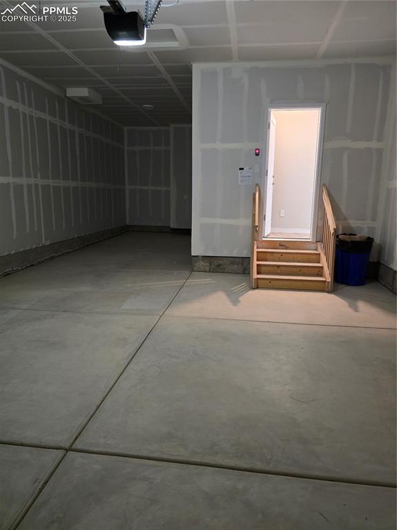 Image 15 of 15: Garage featuring a garage door opener