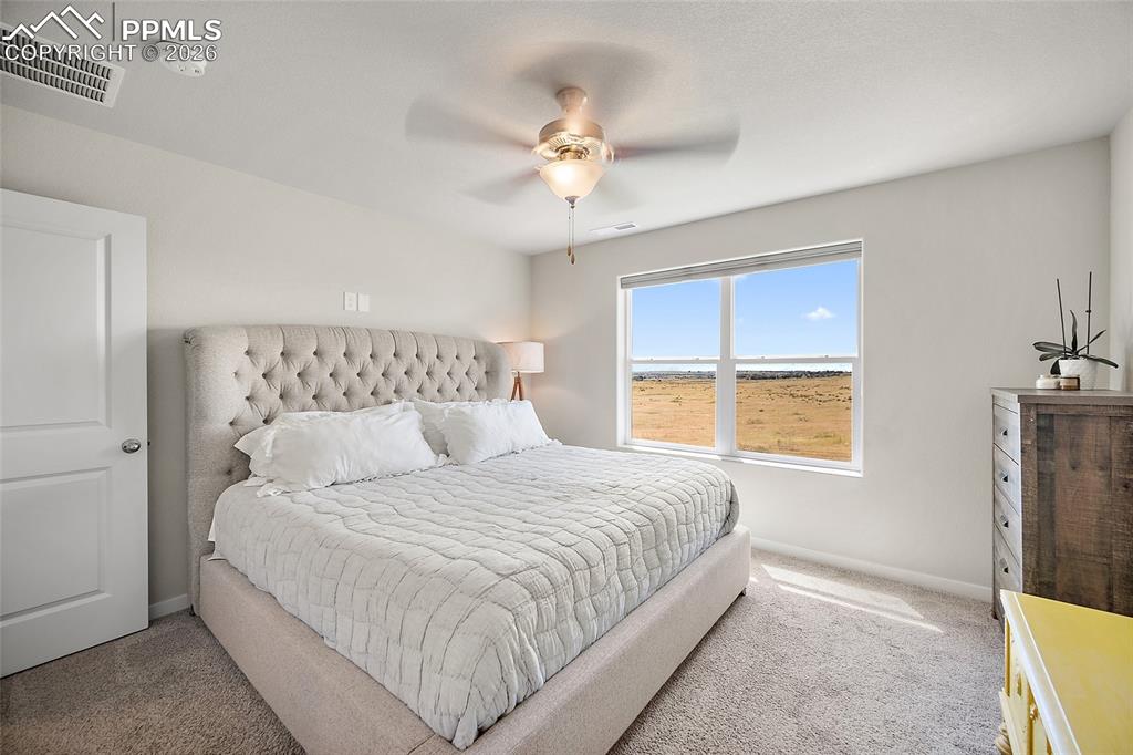 Image 17 of 41: Primary bedroom with beautiful open view