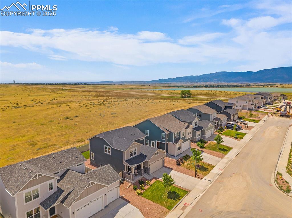 Image 2 of 41: View of the property capturing the open space and mountains