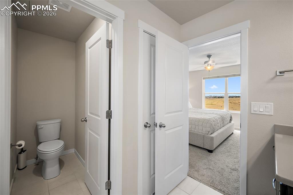 Image 21 of 41: Primary bathroom with private toilet room