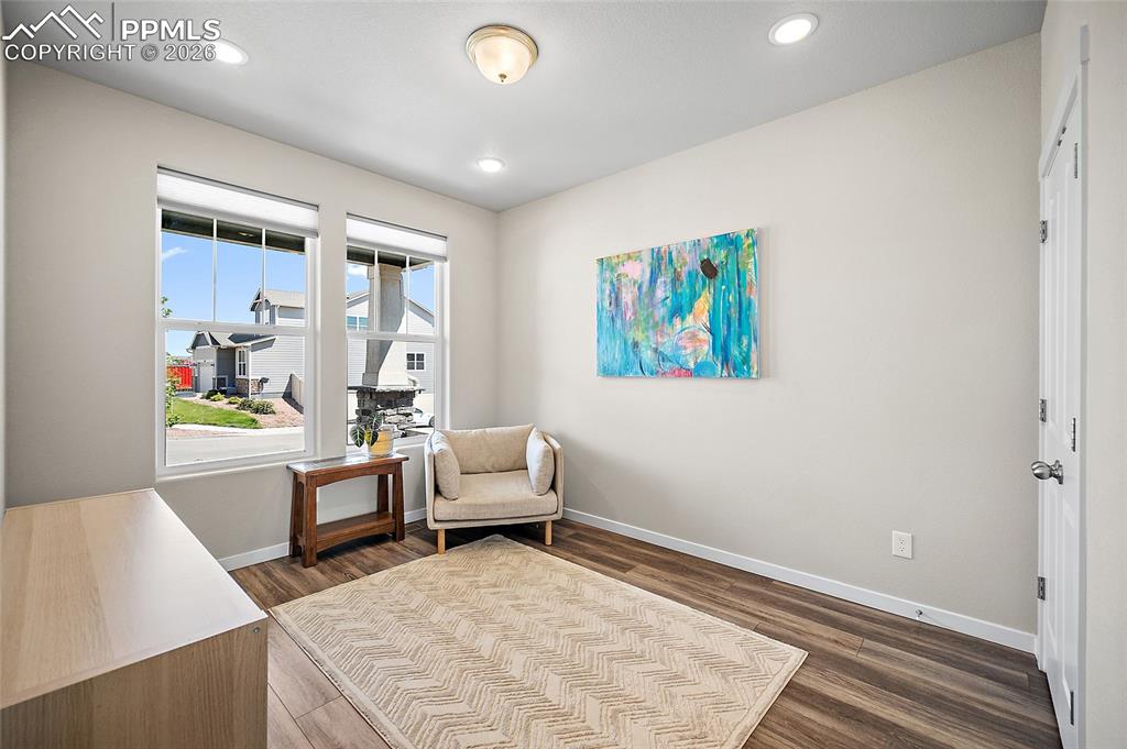 Image 6 of 41: Front sitting room/flex space at entry