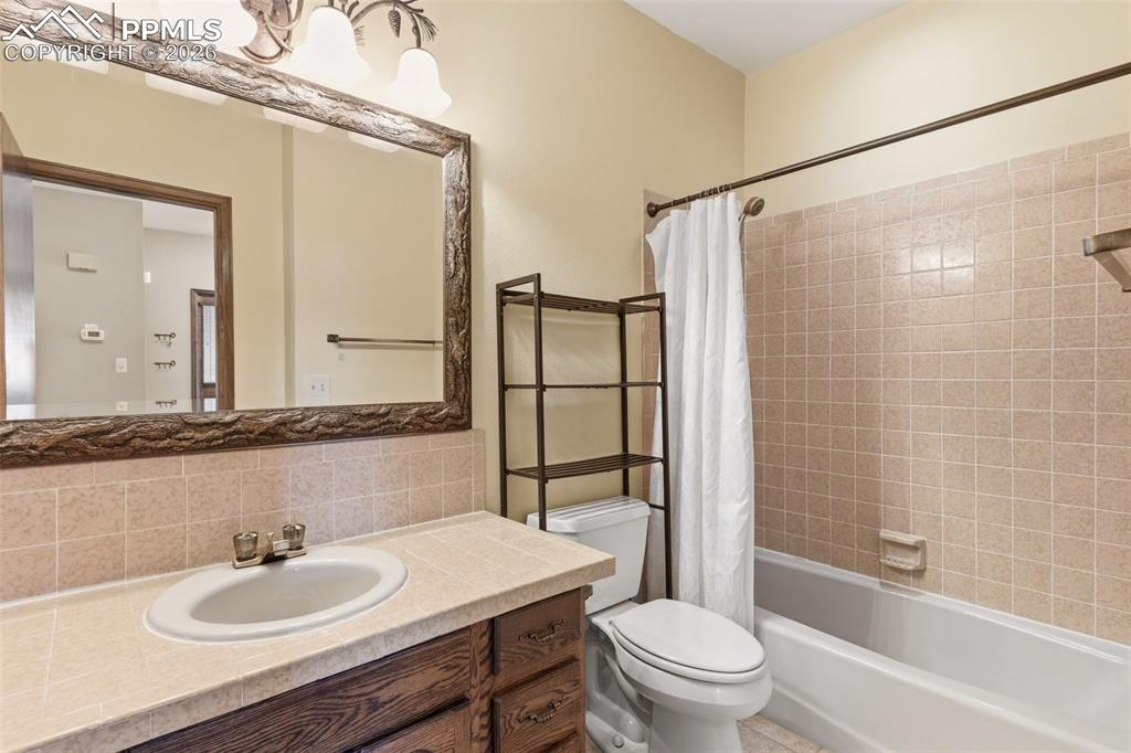 Image 27 of 35: 2nd bathroom with a tub shower combo