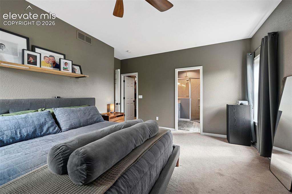 Image 16 of 43: Spacious room featuring carpeted flooring, a ceiling fan, and a neutral wal