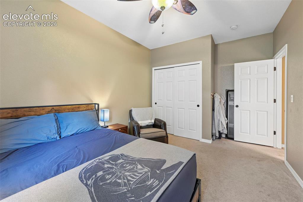 Image 19 of 43: Recessed lighting, ceiling fan, neutral wall tones, and carpeted flooring