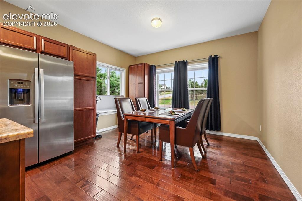 Image 6 of 43: Hardwood-finish flooring, stainless steel refrigerator, abundant cabinetry,